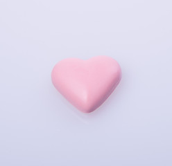 chocolate in pink colour or love shape chocolate.
