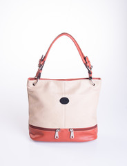 bag or brown leather woman handbag on background.