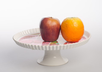 plate or fruits in plate on the background.