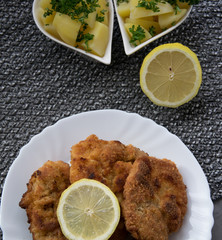 Pork steak fried on lard with parsley potatoes and pastry