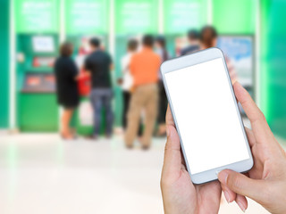 Hand holding smart phone with white screen display with blur people using ATM