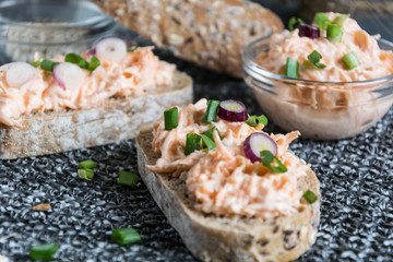 Homemade bread with delicious carrot curd spread with spring onion