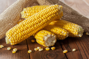 fresh corn on wooden table