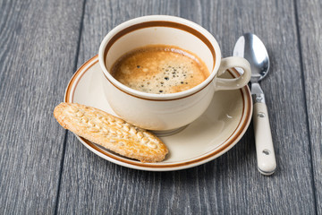 A cup of coffee and biscuits