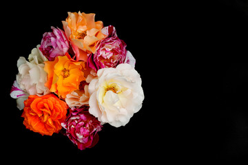 Bouquet of roses black background, flat lay