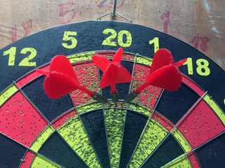 Three darts hitting perfect 180 score on local private dart board.