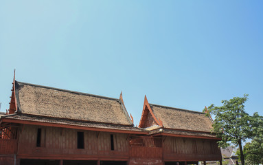 Fototapeta na wymiar Thai vintage wood house with blue sky view, culture public park in Thailand
