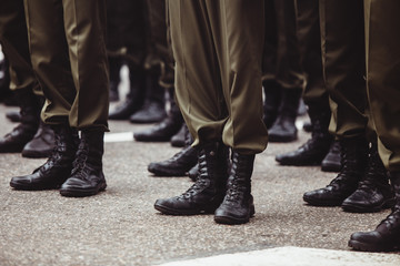 Fototapeta na wymiar military men in green dress uniform stand at attention