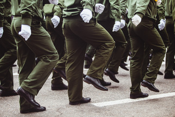 military men in green dress uniform marching to victory parade