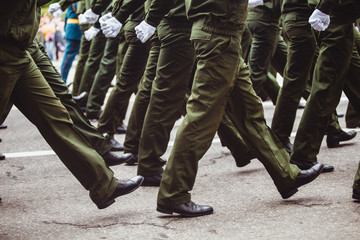 military men in green dress uniform marching to victory parade