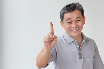 happy old senior man pointing up 1 finger