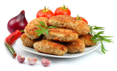 Homemade cutlets with tomato in white plate isolated on white background.