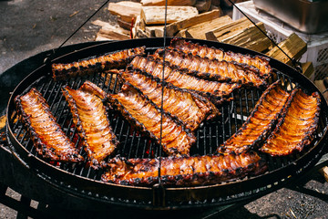 Barbecued spareribs lie on the fire