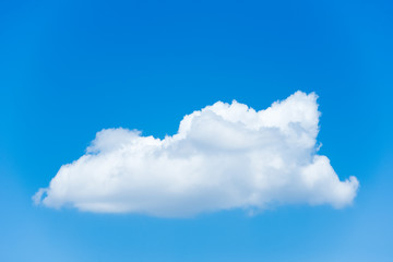 Naklejka na ściany i meble White cloud against a blue sky