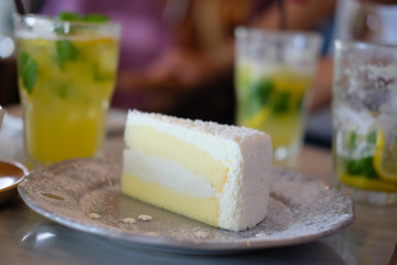 Coconut cake on table in coffee shop