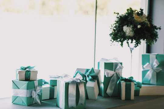 Green Present Boxes Stand On The Windowsill