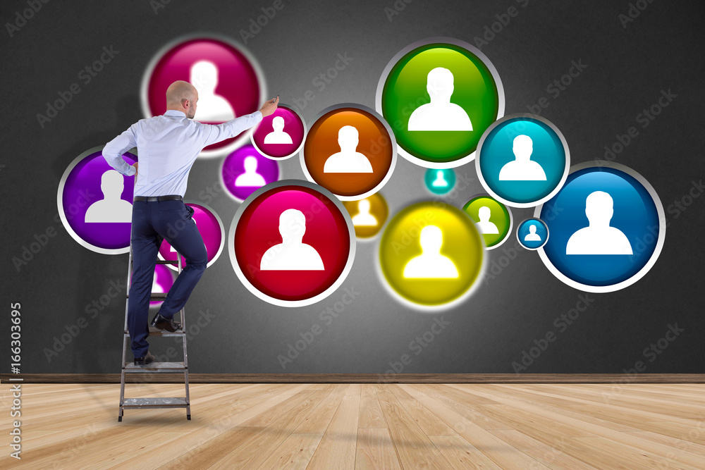 Poster businessman in front of a wall with a group of contact icon displayed on a technology interface back
