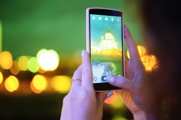 Girl is taking pictures on the phone
