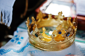 Close-up photo of crowns in the church meant for wedding ceremony.