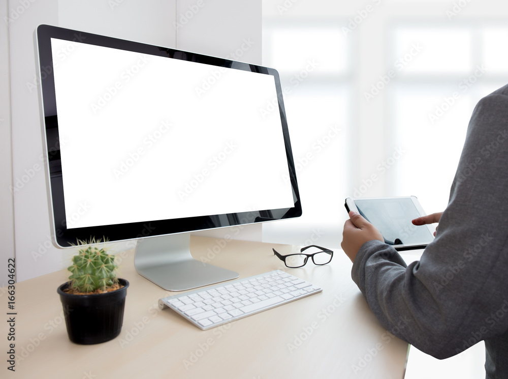 Poster young man working businessman using a desktop computer of the blank screen