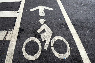 Bicycle pathway sign on asphalt road