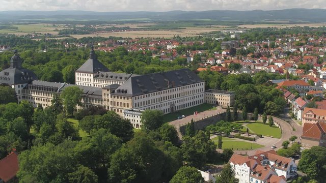 Aerial view high above the German castle "Schloss Friedenstein" Thuringia, Drone birds eye view over the city of Gotha and green landscape 