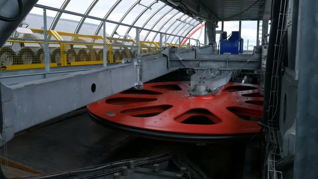 Rotating red flywheel on ropeway mashine room