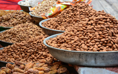 Selling nuts and dried fruits at a bazaar in India