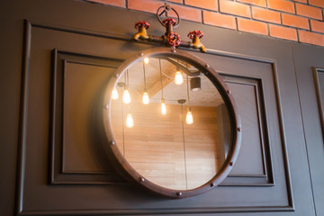 Vintage mirror decorated on old style wall