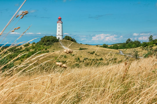 Old lighthouse Dornbusch on sunny summer day. Hiddensee, Baltic Sea.