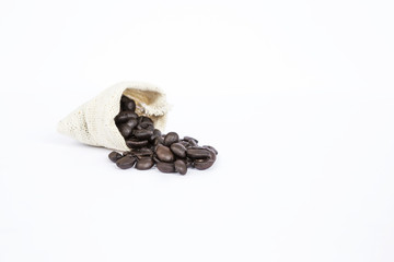 Roasted coffee bean in canvas sack isolate on white background