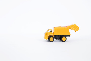 Yellow truck isolate on white background, plastic dump truck toy