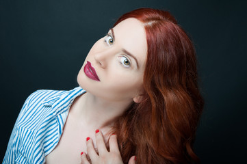 Portrait of fashionable model with red hair