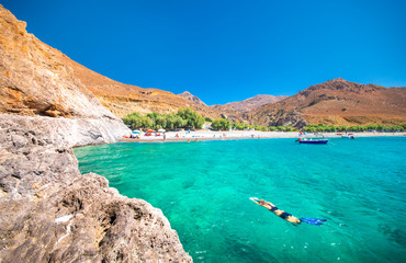 The amazing tropical beach of Panagia Tripiti, in Crete, with sandy beach, turquoise water and some...