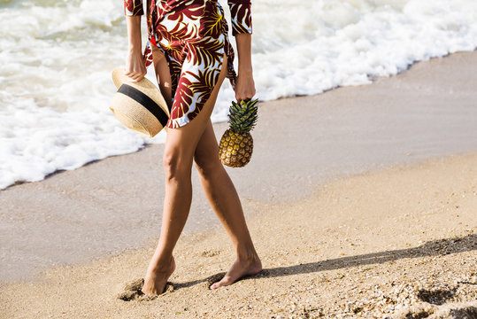 Exotic holiday vacation woman with pineapple