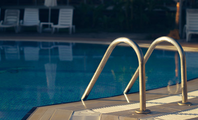 Obraz na płótnie Canvas Pool inox chrome handrails
