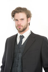 Manager with beard on serious face.