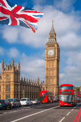 London with red buses against Big Ben in England, UK