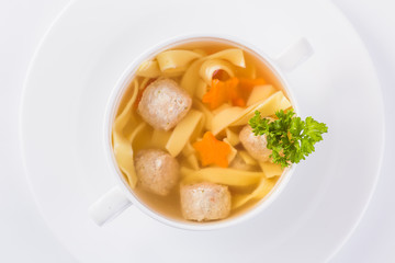 chicken broth on a light background (close)