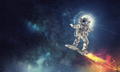 Fototapeta na wymiar Spaceman on flying board. Mixed media