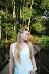 Beautiful Russian girl in the summer forest