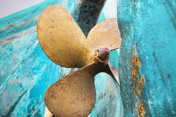 Orange propeller on the cyan blue boat background