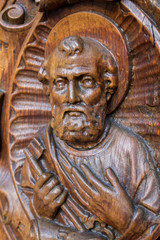 Fototapeta na wymiar Wooden statue St Peter facing upwards