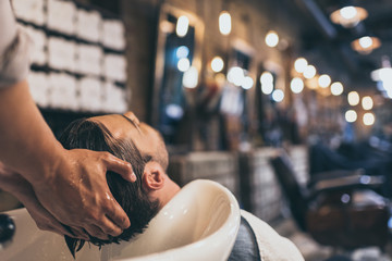 hairstylist washing clients hair