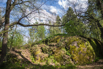 hill under blue sky with clouds