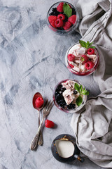 Traditional summer dessert Eton Mess. Broken meringue with whipped cream, berry jam, fresh...