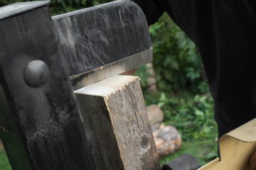 Firewood split with wooden splitter