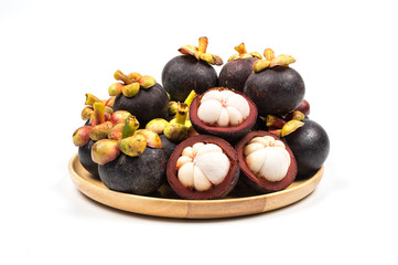 Fresh Mangosteen from Rayong Thailand on wooden plate isolated on white background