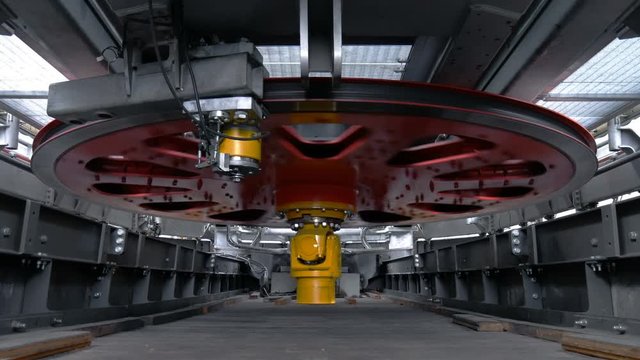 Rotating red flywheel on ropeway mashine room