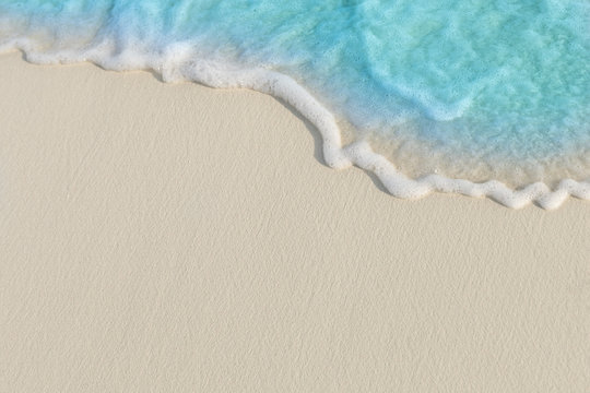 Soft waves of blue sea on the Maldives beach for the background. - Powered by Adobe